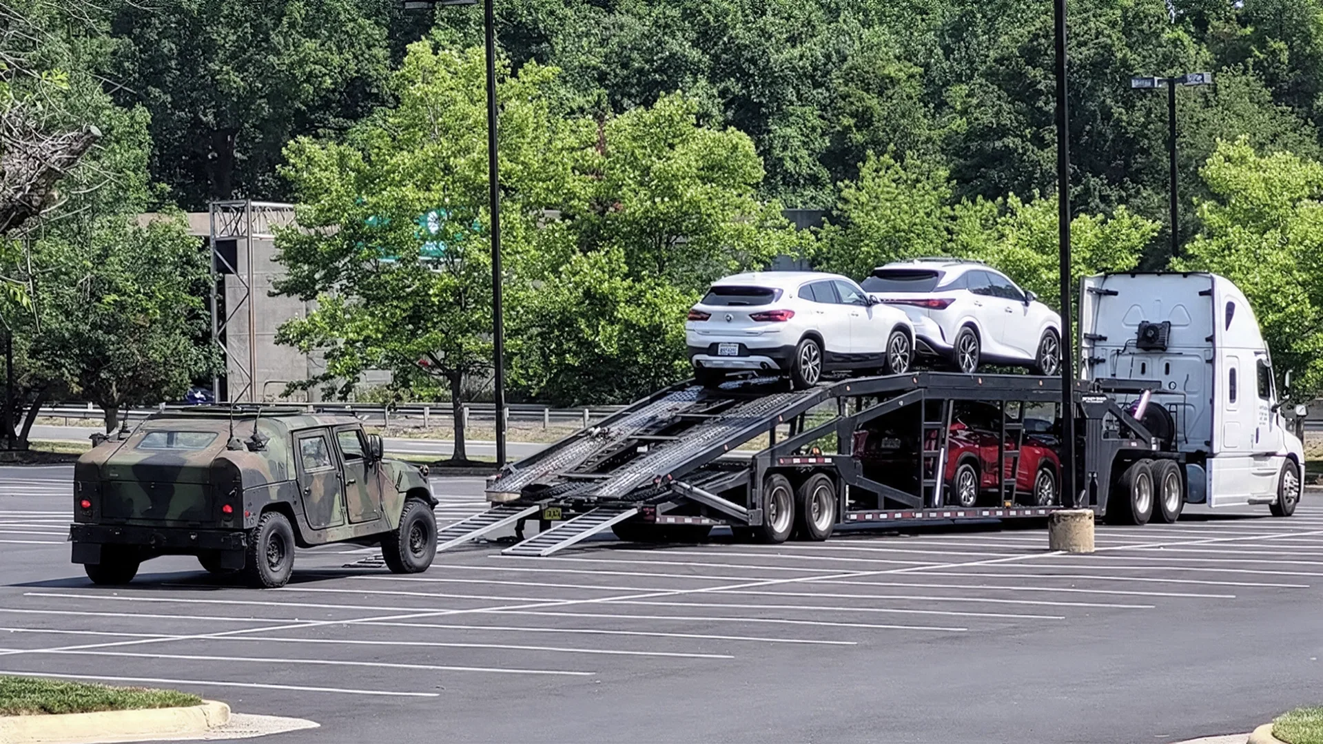 Auto transport carrier shipping vehicles for a military relocation