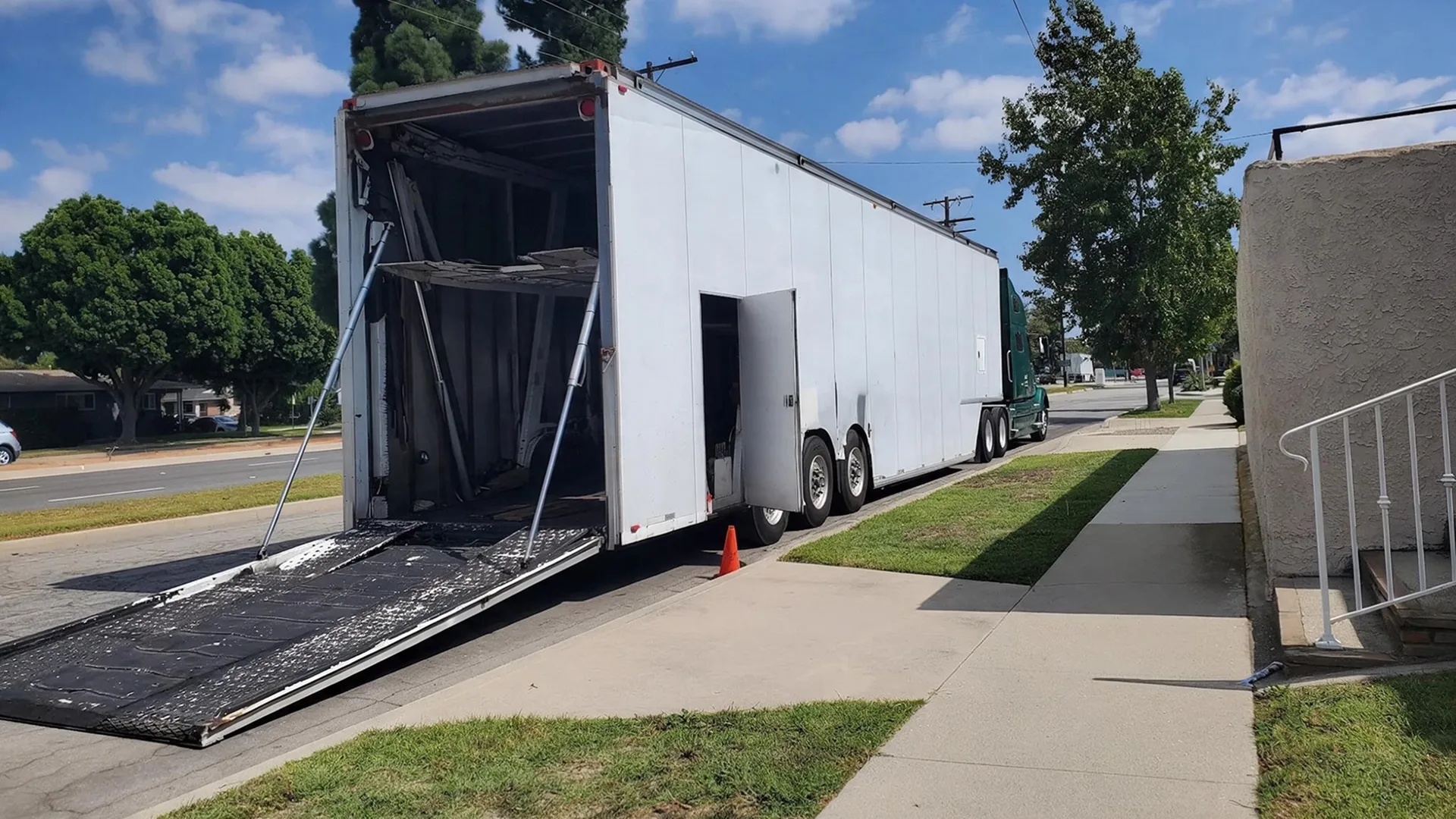 Enclosed auto transport trailer for vehicle shipping in Grand Rapids