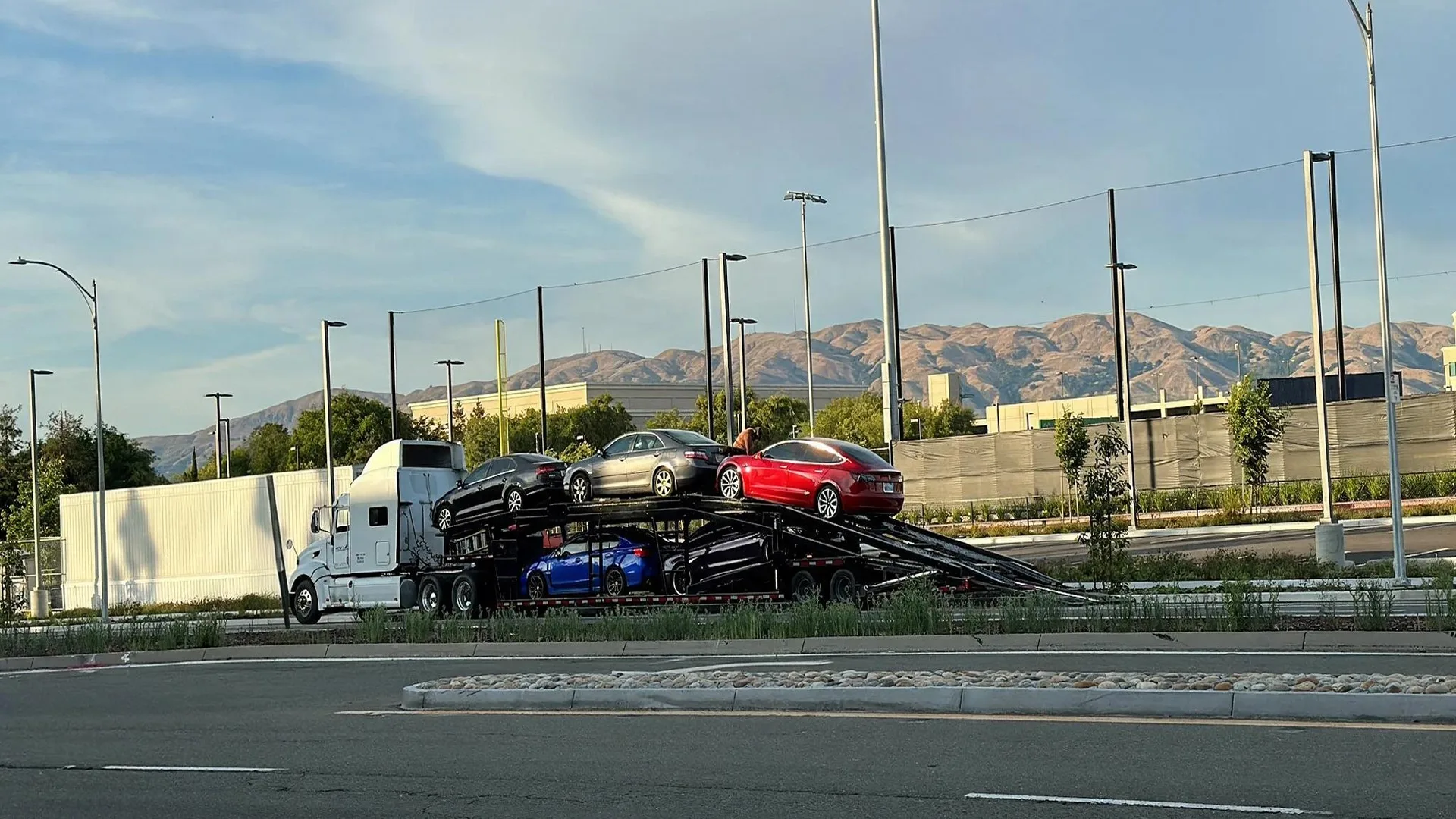 photo of a car carrier transporting vehicles on a long-distance route