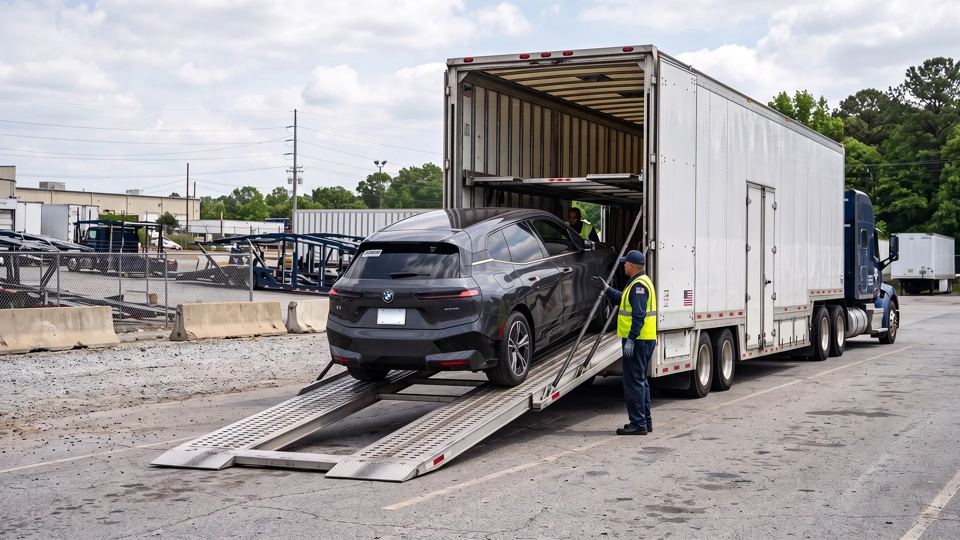 photo of leased vehicle being loaded into an enclosed car carrier