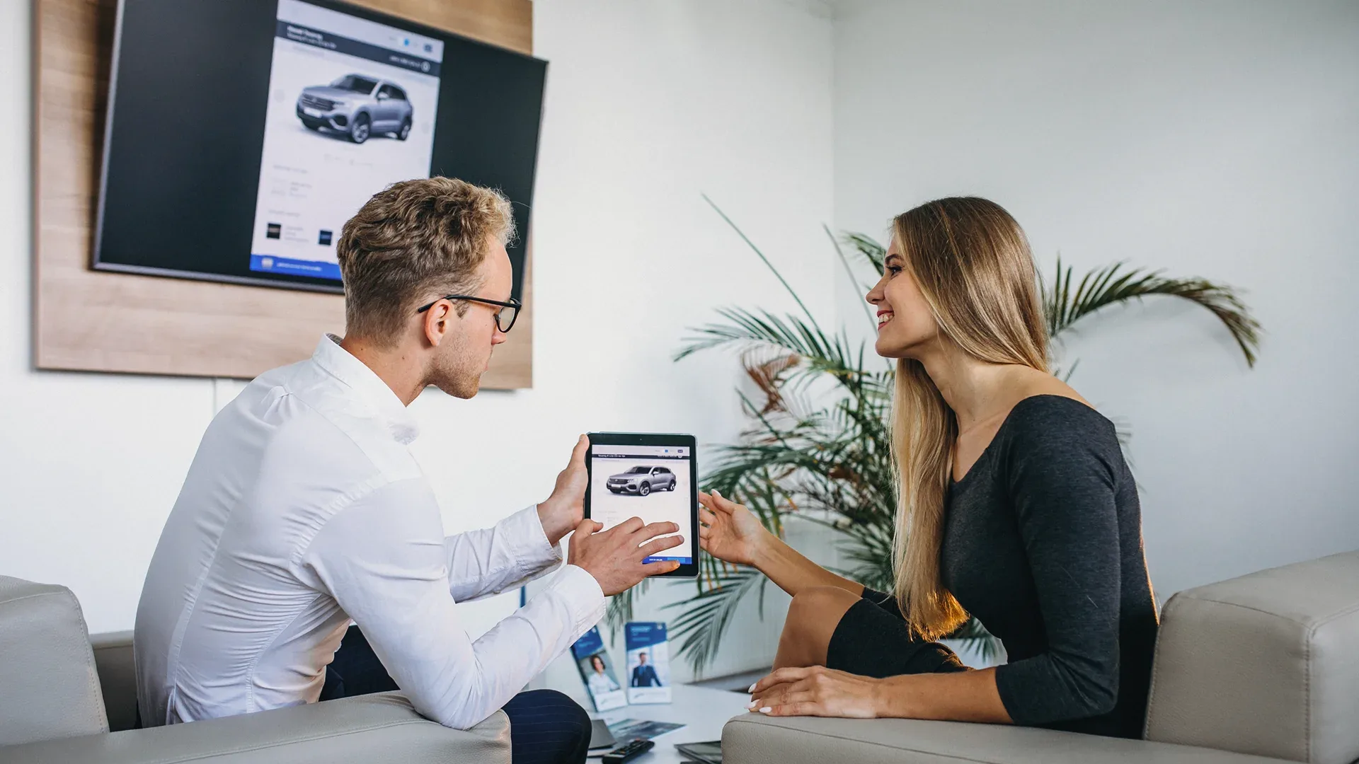 a man is looking for a car online