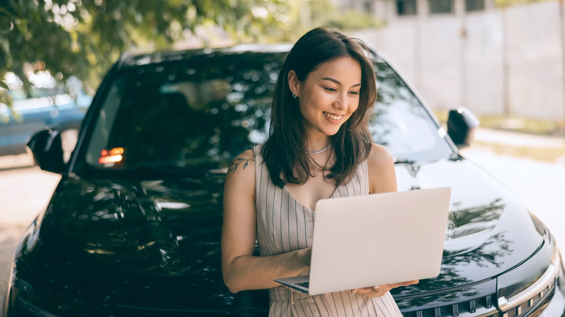 photo of a woman researching car shipping options online