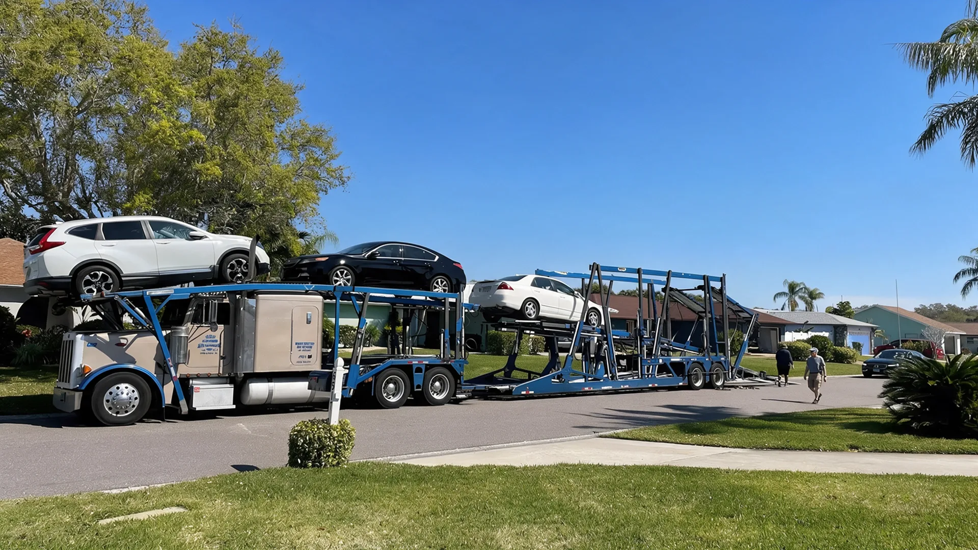 Car being transported on a flatbed tow truck