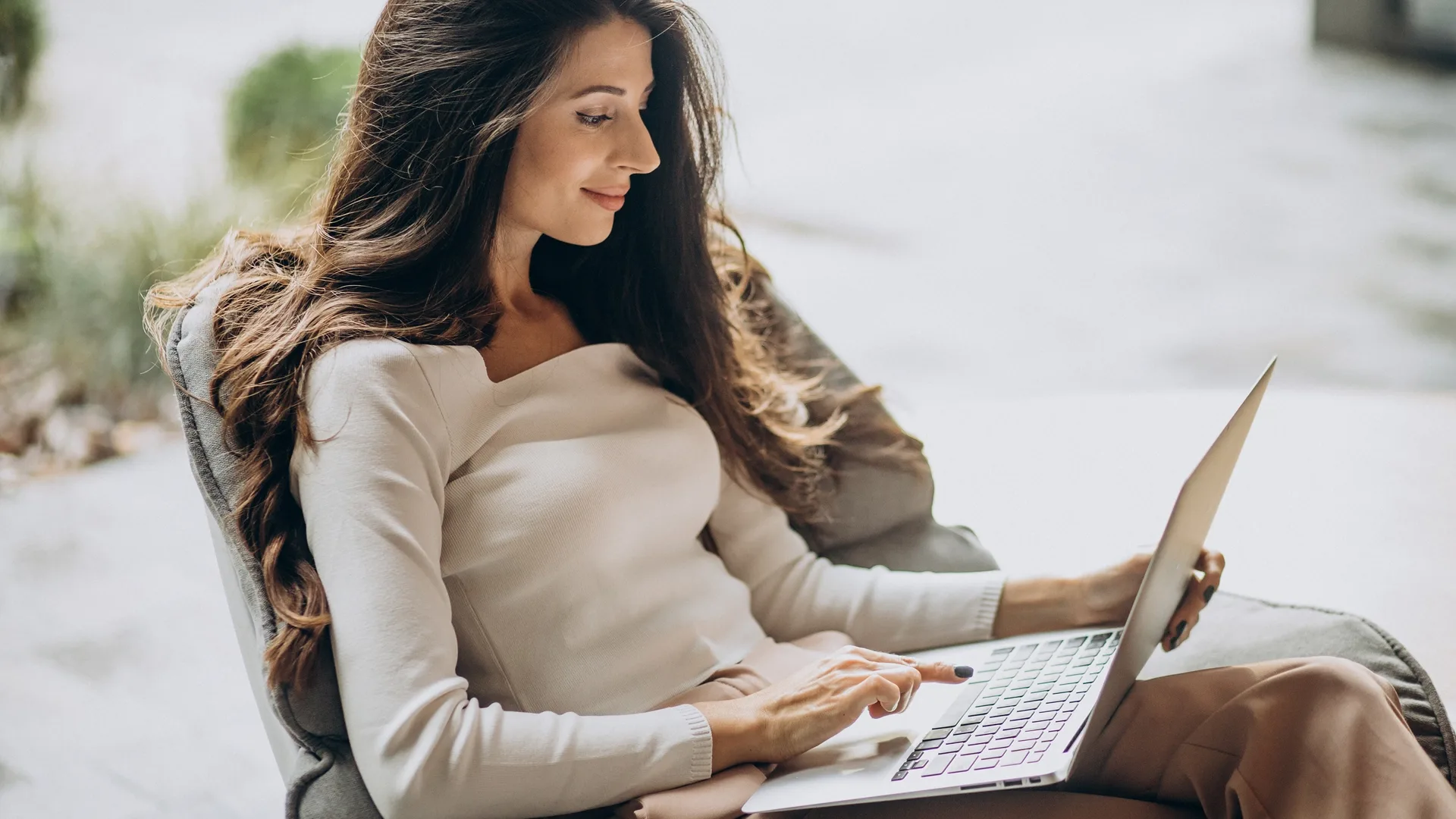 Woman researching a car online before buying