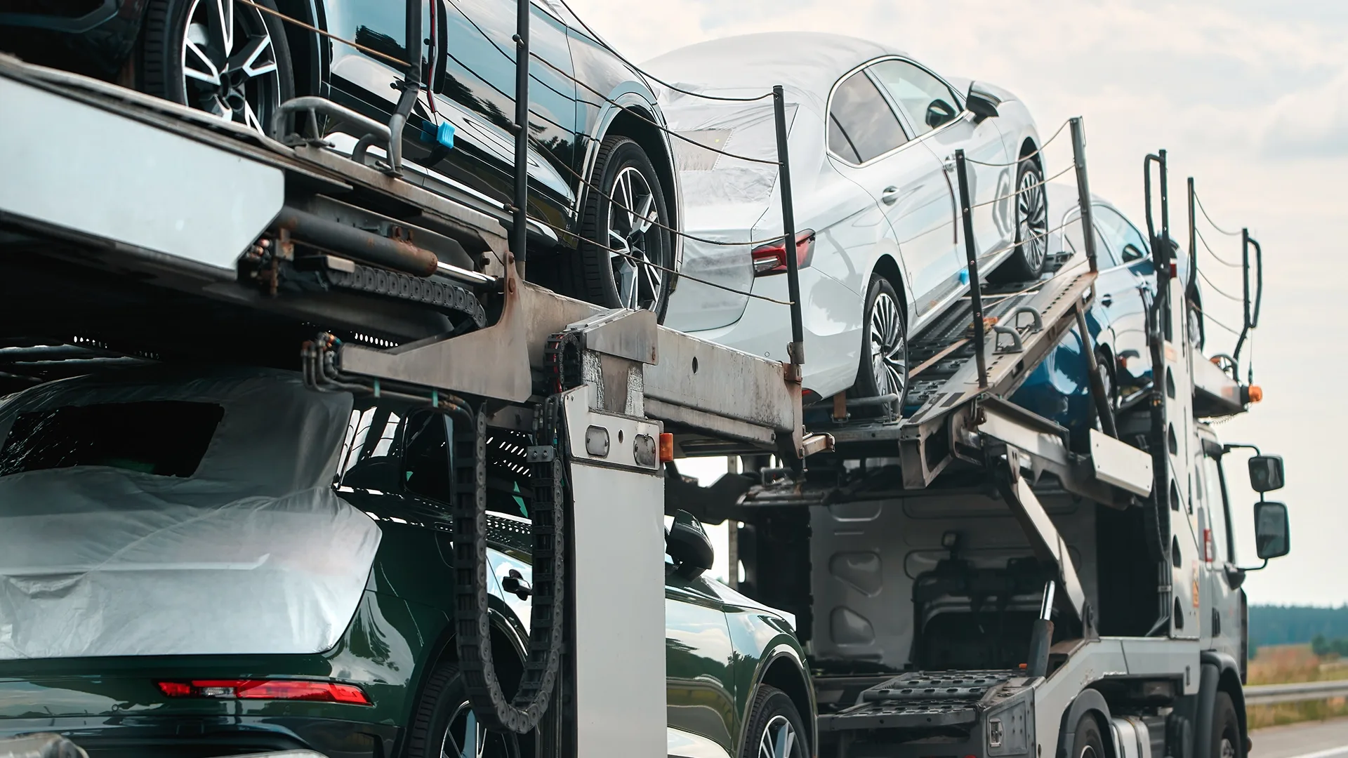 The cars are loaded onto the truck and ready for transportation.