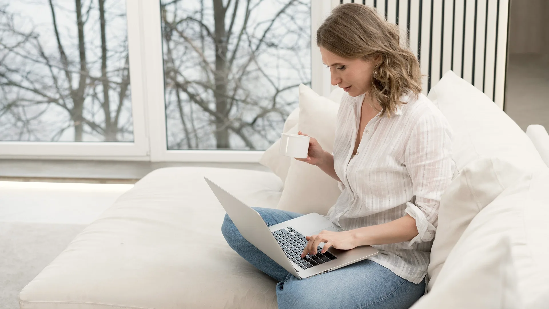 photo of a woman searching for a reliable vehicle transporter online