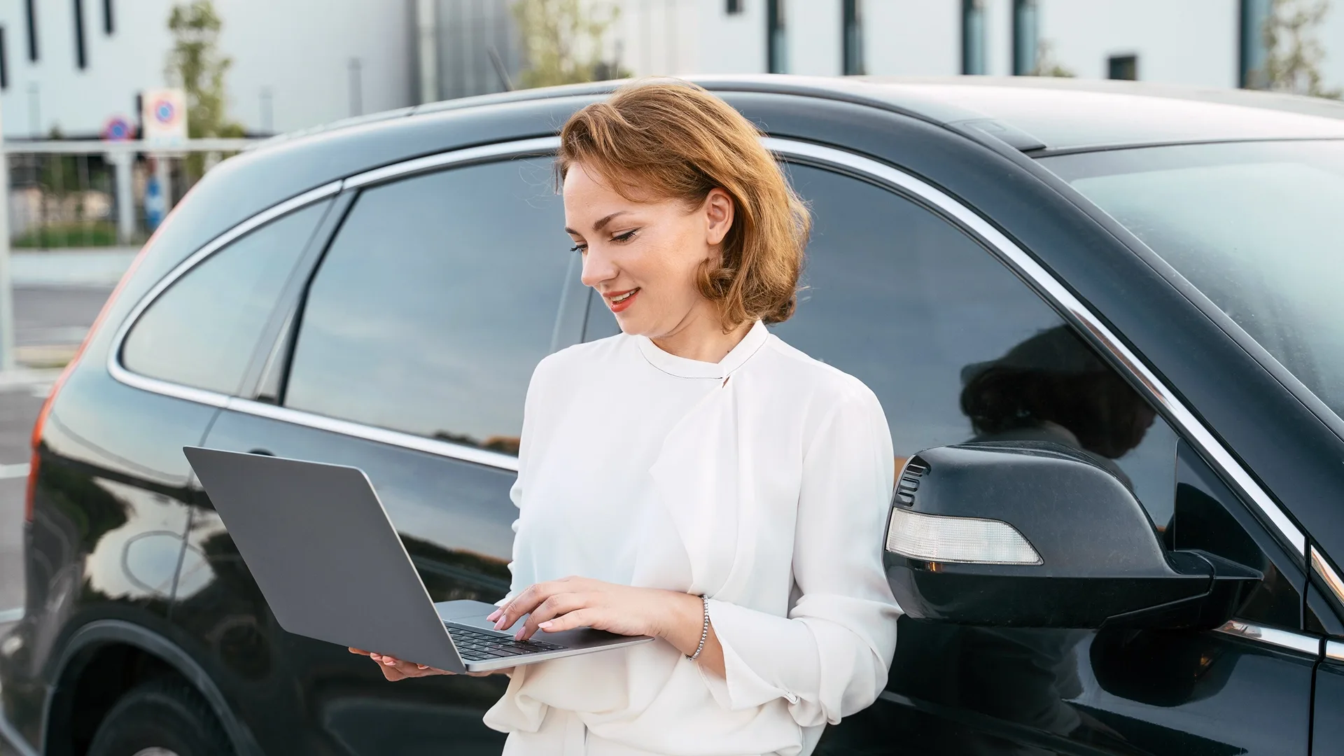 Car owner using an online calculator to check vehicle value