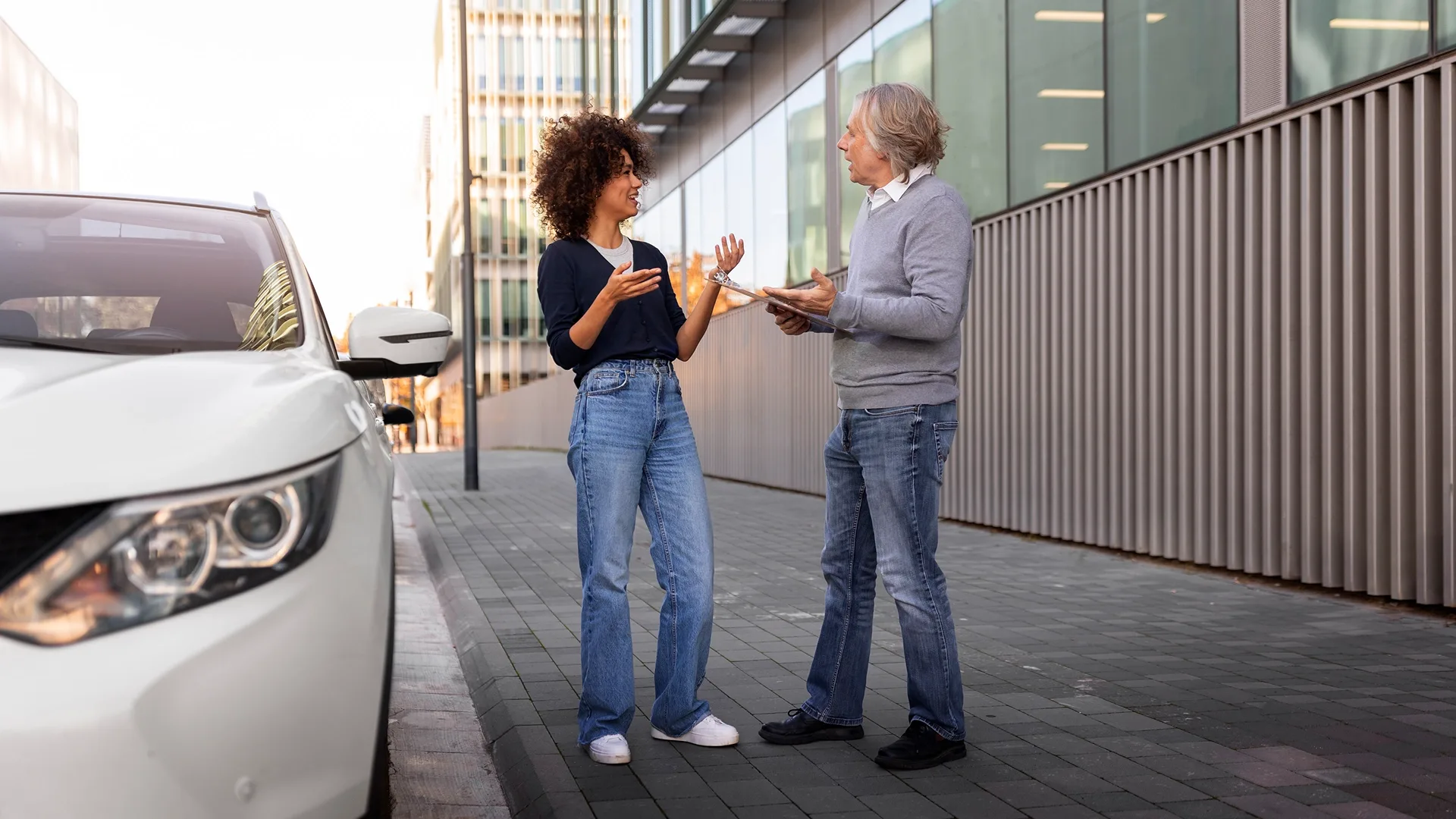 the woman is selling a car