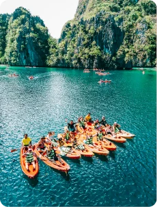 Nexus Auto Transport team kayaking during an outdoor retreat