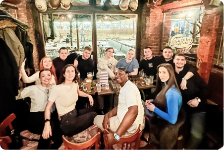 Nexus Auto Transport staff celebrating at a team dinner