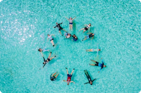 Nexus Auto Transport team participating in a beach retreat