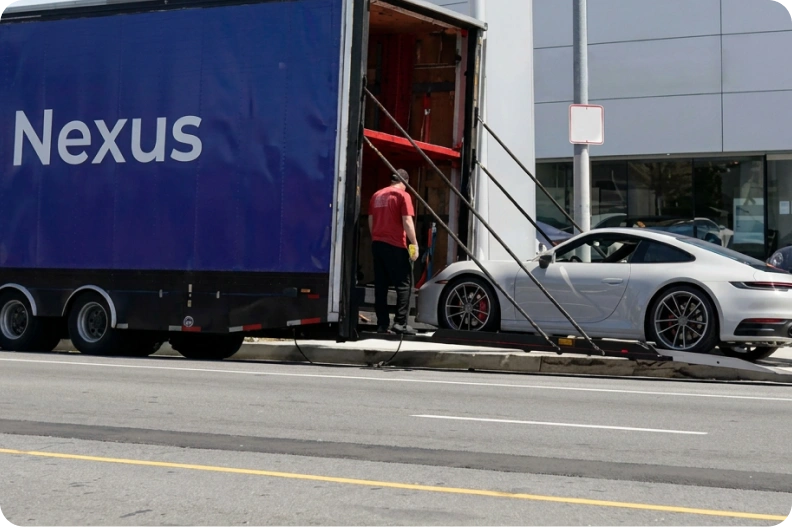 Sports car being loaded into an enclosed Nexus trailer