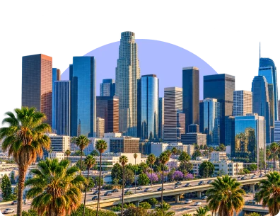 Palm trees beside the Los Angeles skyline